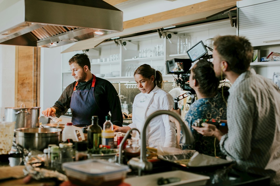 Corporate team doing a cooking workshop as a team building activity